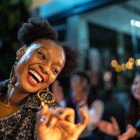 group of friends dancing outside at night - fashion stock pictures, royalty-free photos & images