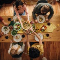 group of friends dining together - food stock pictures, royalty-free photos & images