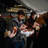 Group of friends eat the Polish donuts during the Fat Thursday in Krakow, Poland on February 27, 2025. The Fat Thursday in Poland, as tradition on...