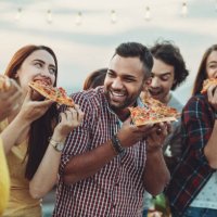 group of friends eating pizza - junk food stock pictures, royalty-free photos & images