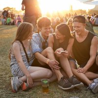 group of friends hanging out on grassfield - concert stock pictures, royalty-free photos & images