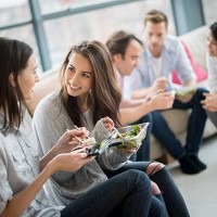 group of friends having dinner - junk food stock pictures, royalty-free photos & images