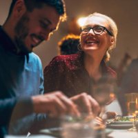 group of friends having fun during a dinner celebration - food stockfoto's en -beelden