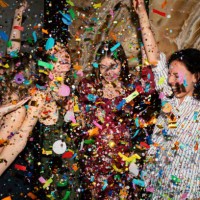 group of friends having fun with confetti at home. - fashion stock pictures, royalty-free photos & images