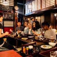 group of friends ordering food in japanese izakaya - food stock pictures, royalty-free photos & images
