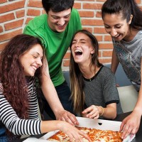 group of people eating pizza - junk food stock pictures, royalty-free photos & images