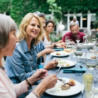 group of people enjoying an outdoor meal together - food stock pictures, royalty-free photos & images