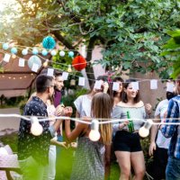 group of pretty young people have a summer party in a backyard - garden decoration stock pictures, royalty-free photos & images