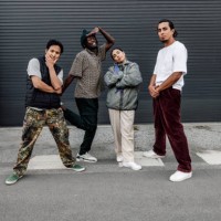 group of street hip hop breakdancers posing looking to camera - fashion stock pictures, royalty-free photos & images
