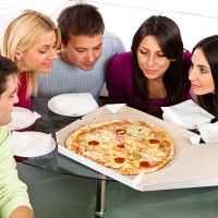 group of young students preparing to eat pizza - junk food stock pictures, royalty-free photos & images