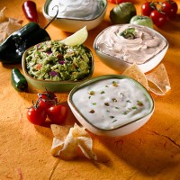 guacamole and mexican cheese dips - junk food stock pictures, royalty-free photos & images