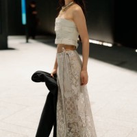Guest is seen wearing a beige top, beige maxi lace skirt, black shoes during Rakuten Tokyo Fashion Week A/W 2025 on March 19, 2025 in Tokyo, Japan.