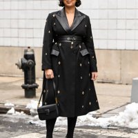 Guest is seen wearing a black and gold embellished coat, black bag, black shoes and black sunglasses outside the Michael Kors show during NYFW F/W...