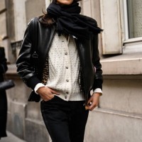 Guest is seen wearing a black leather jacket, white sweater, black pants with black sunglasses outside the Gabriela Hearst show during Womenswear...