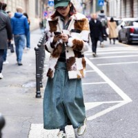 Guest is seen wearing a green hat with white littering details, a long denim skirt, white New Balance sneakers, grey lurex socks, a denim jacket and...