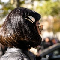Guest is seen wearing a Miu Miu jacket and hair clips outside the Miu Miu show during Womenswear Spring/Summer 2025 as part of Paris Fashion Week on...