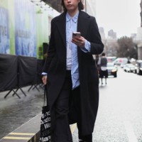 Guest is seen wearing a SB black wool coat with a pair black leather moccasins outside the S.S.Daley show during London Fashion Week February 2025 on...