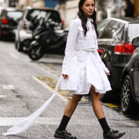 Guest is seen wearing a white Cecilie Bahnsen top and skirt with black shoes outside the Cecilie Bahnsen show during Womenswear Spring/Summer 2025 as...