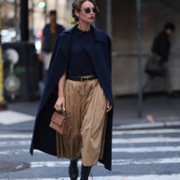 Guest seen wearing a dark blue shirt, matchy dark blue long jacket, beige brown wide pants, Carolina Herrera brown leather handbag and black belt,...