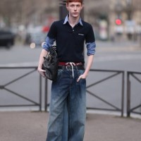 Guest seen wearing a Miu Miu navy blue Poloshirt over a blue shirt, Miu Miu large black leather bag, gold jewellery, Miu Miu red underwear with bow,...