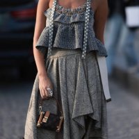 Guest seen wearing Louis Vuitton gold necklace, grey checked ruffled tank top, grey ruffled midi skirt, Louis Vuitton brown monogram canvas / leather...