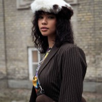 Guest wearing brawn jacket and brown and white fur beret outside Stine Goya in Copenhagen fashion week Autumn/Winter 2022 on February 02, 2022 in...