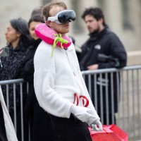 Guest wearing the apple vision pro attends the Loewe Womenswear Fall/Winter 2024-2025 show as part of Paris Fashion Week on March 01, 2024 in Paris,...