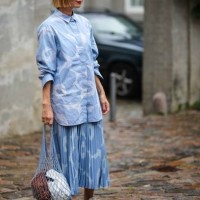 Guest wears a blue and pale blue print pattern shirt neck / long sleeves / buttoned shirt, a matching blue and pale blue print pattern pleated /...