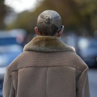 Guest wears a brown corduroy jacket, outside Miu Miu, during the Womenswear Spring/Summer 2024 as part of Paris Fashion Week on October 03, 2023 in...