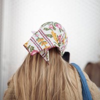Guest wears a head scarf outside Munthe during the Copenhagen Fashion Week AW24 on February 1, 2024 in Copenhagen, Denmark.