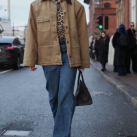 Guest wears a Prada X Carhartt Work Jacket at Deadwood during the Copenhagen Fashion Week Autumn/Winter 2025 on January 28, 2025 in Copenhagen,...
