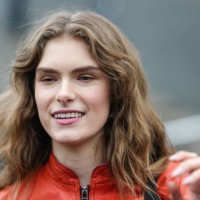 Guest wears a red leather jacket, outside Gucci, during the Milan Fashion Week Womenswear Fall/Winter 2025/2026 on February 25, 2025 in Milan, Italy.