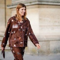 Guest wears a Vuitton brown monogram pyjama outfit, outside Louis Vuitton, during Paris Fashion Week Womenswear Fall/Winter 2019/2020, on March 05,...