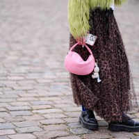 Guest wears a yellow / green fluffy oversized jacket , a flowing tulle leopard print pattern gathered and pleated skirt, blue tights, black leather...