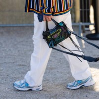 Guest wears Balenciaga bag outside Casablanca during the Womenswear Fall/Winter 2025/2026 as part of Paris Fashion Week on March 05, 2025 in Paris,...