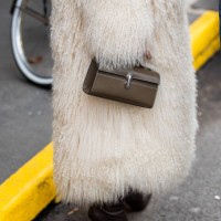Guest wears brown bag outside Anna Sui during New York Fashion Week on February 08, 2025 in New York City.