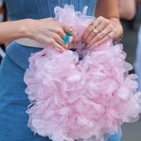 Guest wears denim corsen and flower organza bag during the Milan Fashion Week Menswear Spring/Summer 2025 on September 21, 2024 in Milan, Italy.