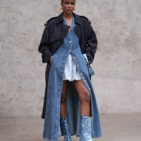 Guest wears, gold earrings, dark blue trench coat, navy blue denim jean unbuttoned midi dress, white blue striped buttoned long sleeve oversized...