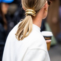 Guest wears golden hair clip outside Lacoste during Womenswear Spring/Summer 2025 as part of Paris Fashion Week on October 01, 2024 in Paris, France.