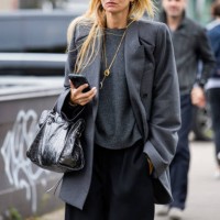 Guest wears grey blazer outside Valentino during Womenswear Spring/Summer 2025 as part of Paris Fashion Week on September 29, 2024 in Paris, France.