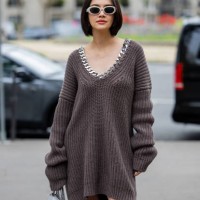Guest wears grey knitted dress outside Stella McCartney during Womenswear Spring/Summer 2025 as part of Paris Fashion Week on September 30, 2024 in...