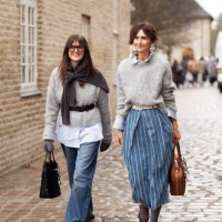 Guest wears grey sweater with black belt, blue jeans, animal print shoes and black bag with accessories and a guest wears grey sweater, blue denim...