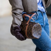 Guest wears Louis Vuitton bag, gloves outside Ziad Nakad during the Haute Couture Spring/Summer 2024 as part of Paris Fashion Week on January 24,...