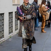 Guest wears scarf with print, coat, skirt outside Pierre-Louis Mascia during the Milan Fashion Week Menswear Fall/Winter 2025-2026 on January 17,...