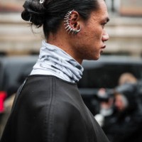 Guest, wears silver ear cuff, outside Vivienne Westwood, during the Womenswear Fall/Winter 2024/2025 as part of Paris Fashion Week on March 02, 2024...
