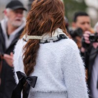 Guest wears white light blue layered collar white oversized buttoned fuzzy tweed Chanel blazer jacket, white oversized fuzzy tweed Chanel mini...