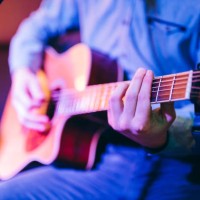 guitar player in a café - concert stock pictures, royalty-free photos & images