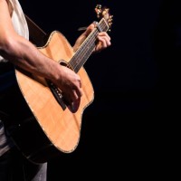 guitarist - singer playing the guitar during his concert - concert stock pictures, royalty-free photos & images