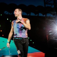 Guy Berryman and Chris Martin of Coldplay perform at Stadio San Siro, on June 25, 2023 in Milan, Italy.