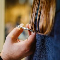 hairdresser cutting a woman's hair - hairstyle stock pictures, royalty-free photos & images